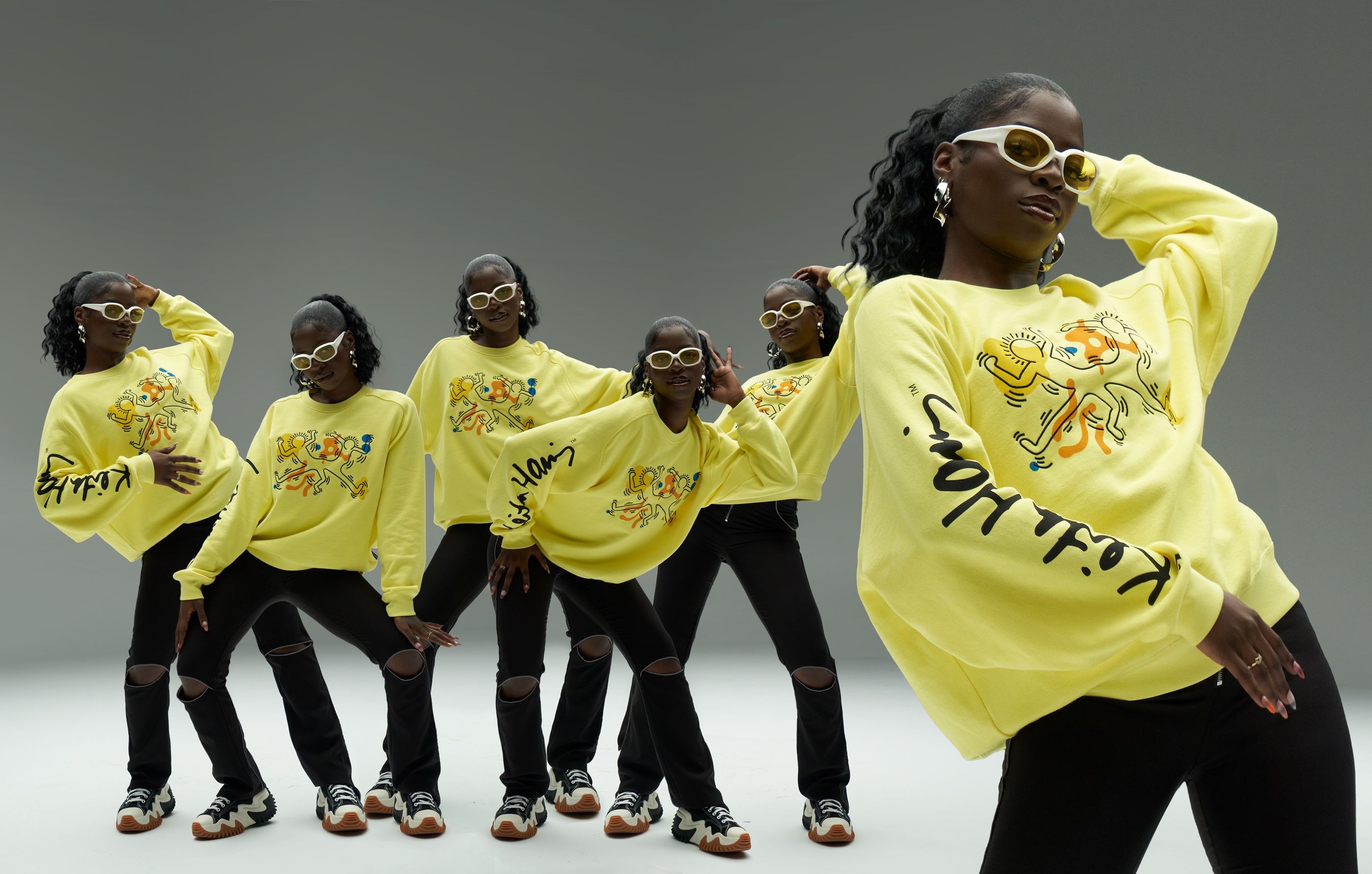 Multiple exposure of a woman in a yellow Keith Haring-print sweatshirt and sunglasses, posing repeatedly.